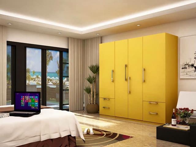 Room Bathes in a Creamy Warmth, Accentuated by a False Ceiling