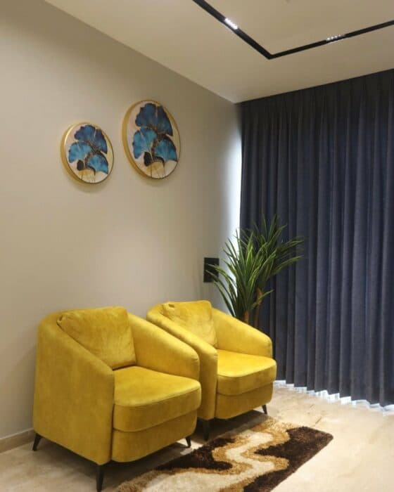 Two Yellow Upholstered Chairs