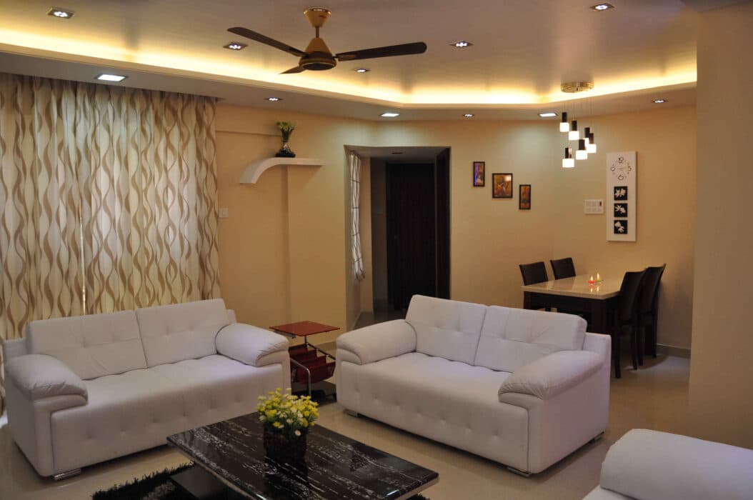 Modern Well-Illuminated Living Room Characterized by Beige Walls