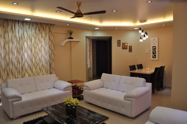 Modern Well-Illuminated Living Room Characterized by Beige Walls