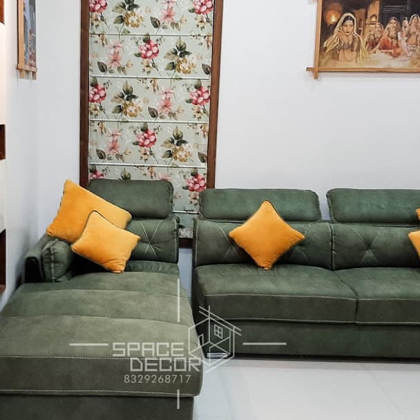 Living Room Featuring a Plush L-Shaped Green Sofa