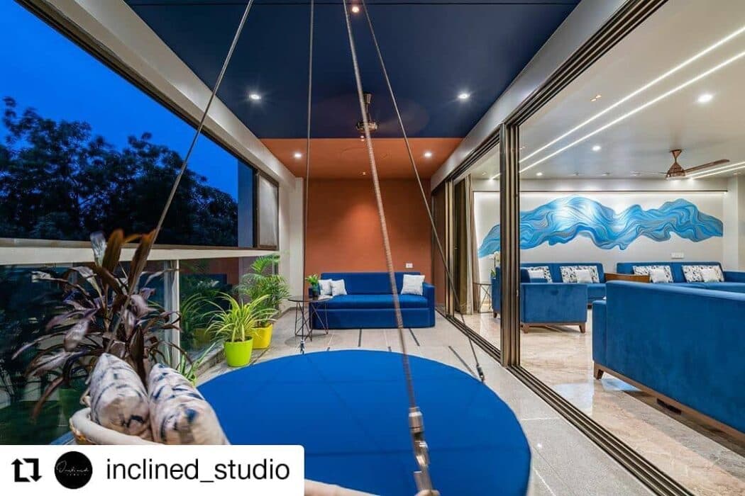 Elegant Indoor-Outdoor Living Space Features a Cosy Swing