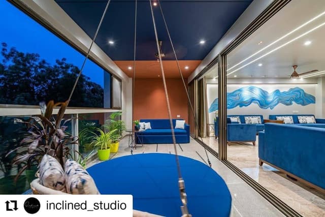 Elegant Indoor-Outdoor Living Space Features a Cosy Swing