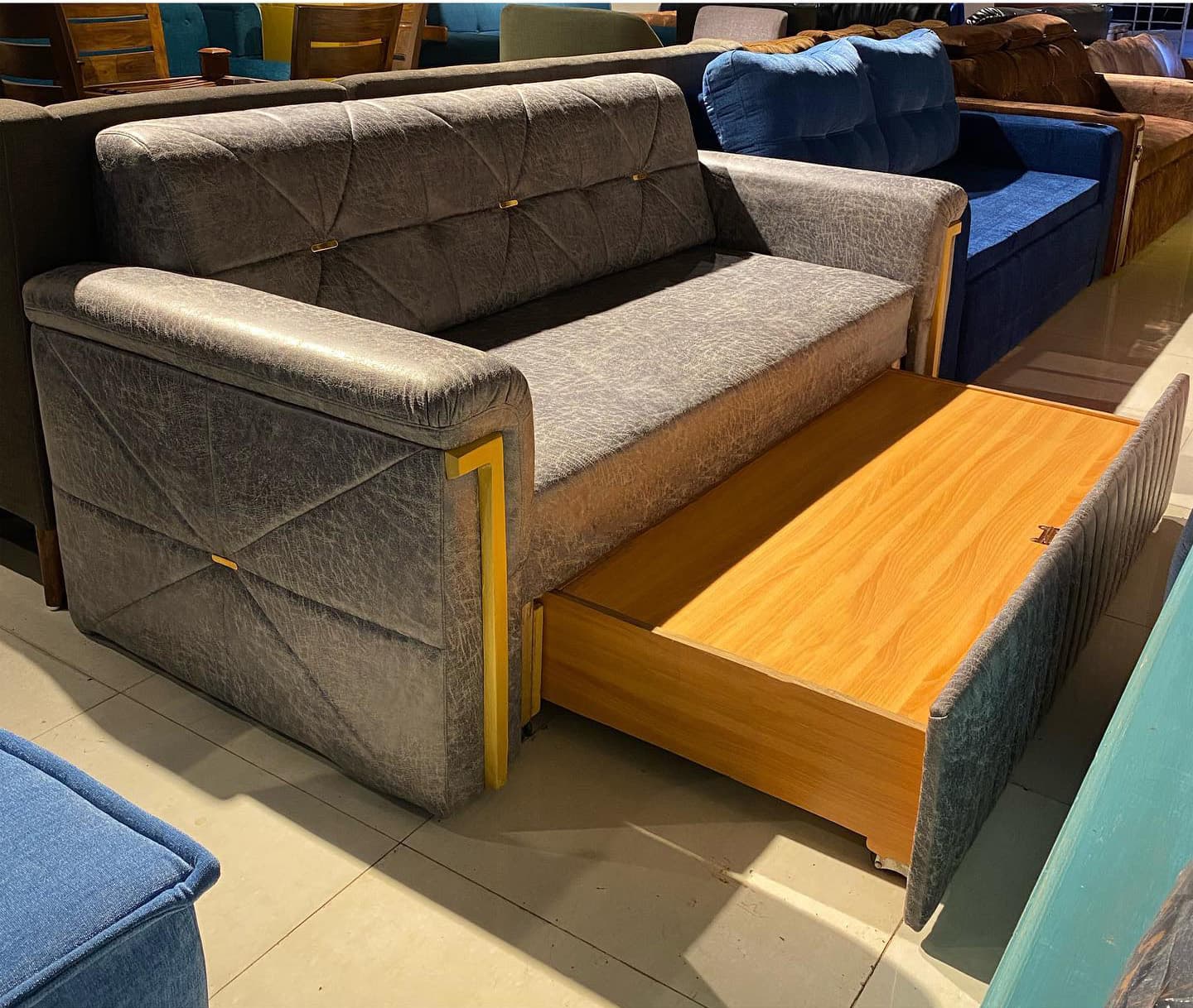 Modern Grey Sofa Features a Sleek Quilted Backrest