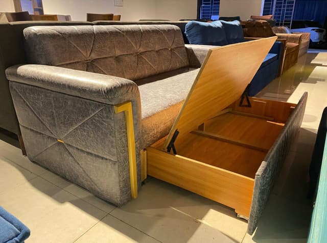 Modern Grey Sofa Features a Sleek Quilted Backrest