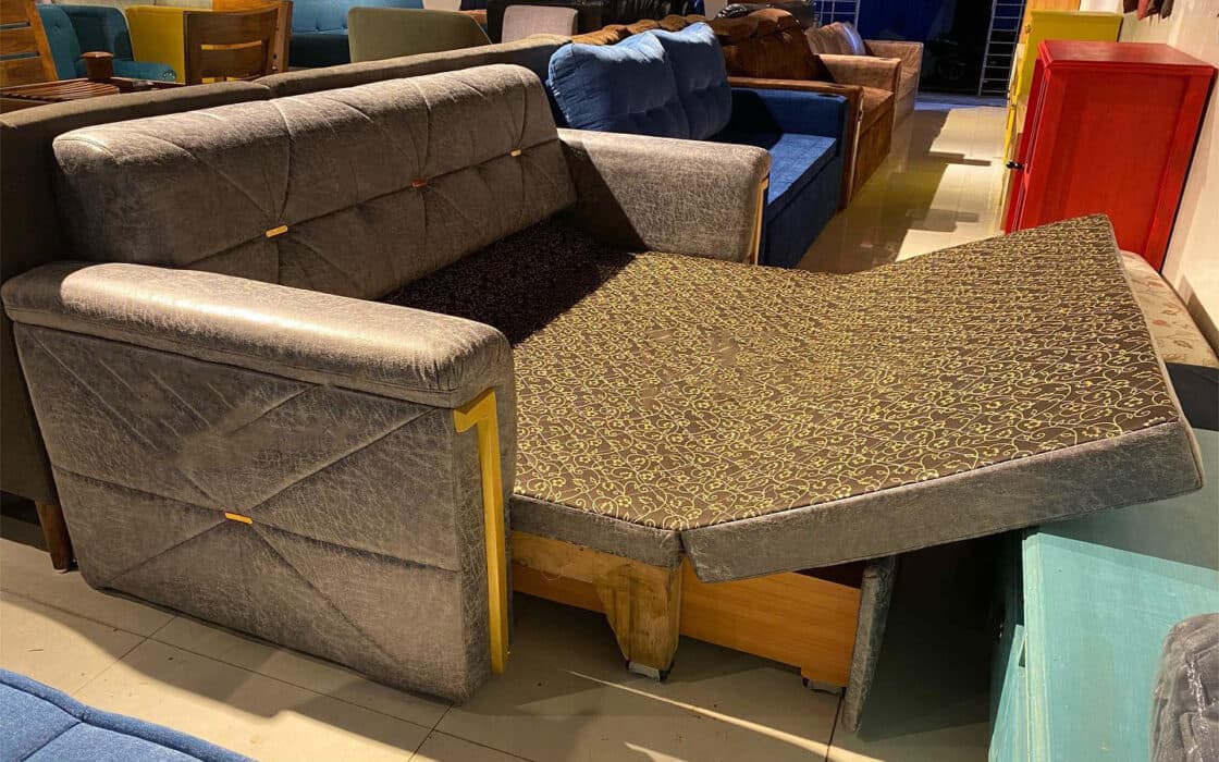 Modern Grey Sofa Features a Sleek Quilted Backrest