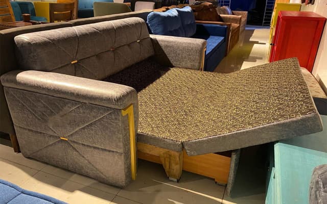 Modern Grey Sofa Features a Sleek Quilted Backrest