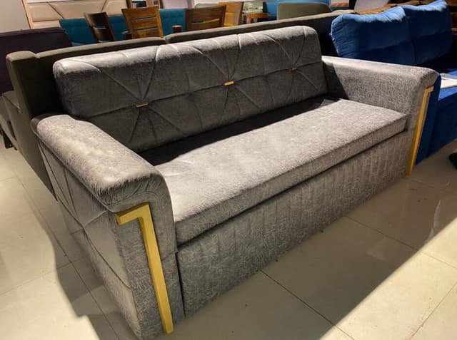 Modern Grey Sofa Features a Sleek Quilted Backrest