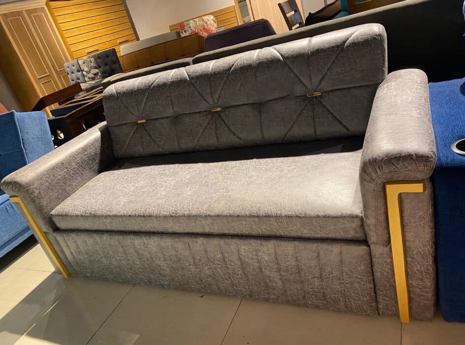 Modern Grey Sofa Features a Sleek Quilted Backrest
