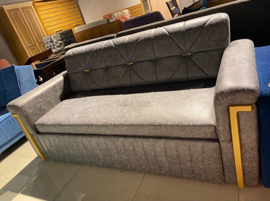 Modern Grey Sofa Features a Sleek Quilted Backrest