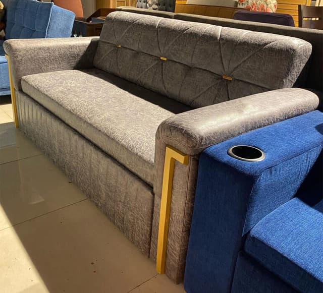 Modern Grey Sofa Features a Sleek Quilted Backrest
