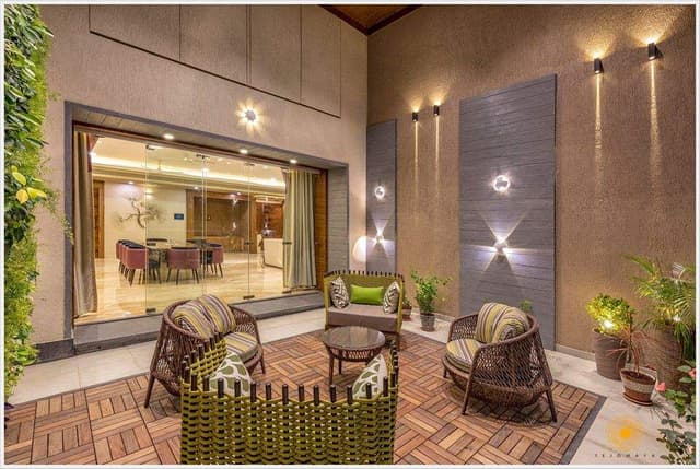 Double-Heighted-Home-Garden-outside-Dining-Area-with-10-Seater-Dining-Table-Upholstered-Dining-Chairs-comprises-of-Wooden-Tile-Flooring-1 Modern Patio with Wicker Furniture