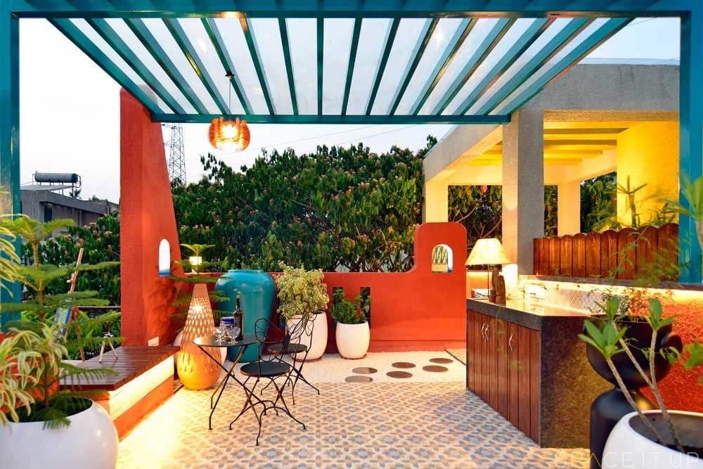 Home-Garden-on-Terrace-Floor-having-Parapet-Wall-with-Red-Wall-Paint-having-Voids-with-Blue-Wall-Paint-11 Design Detail Banner 9