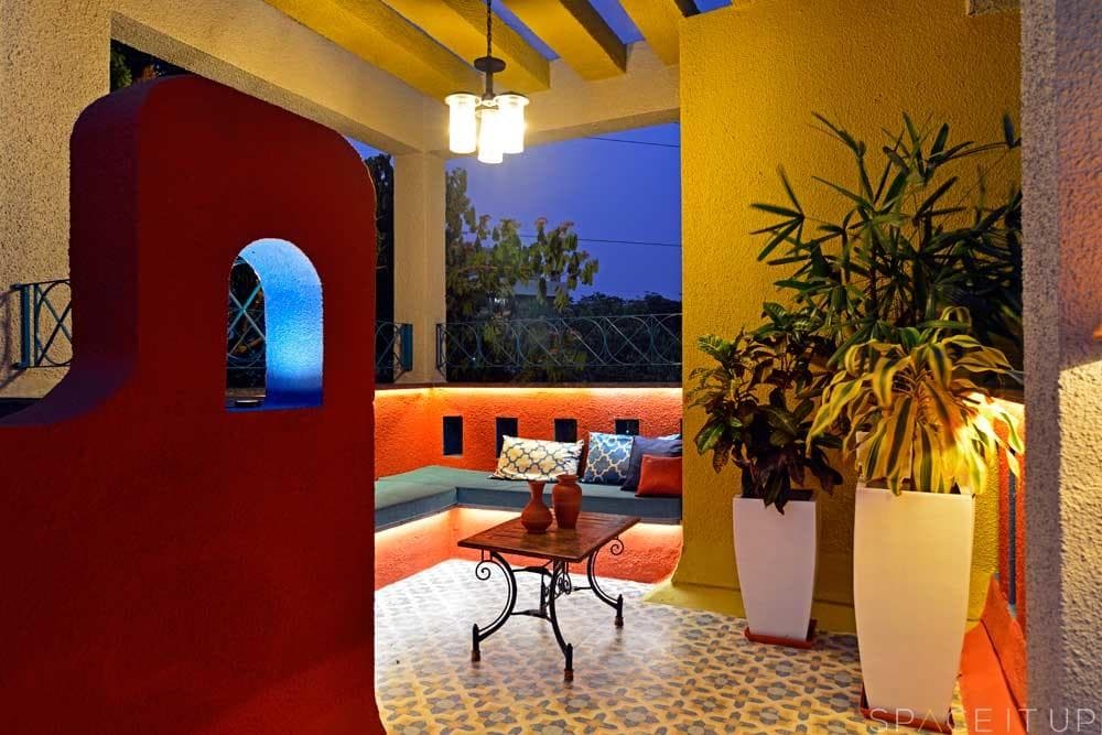Home-Garden-on-Terrace-Floor-having-Parapet-Wall-with-Red-Wall-Paint-having-Voids-with-Blue-Wall-Paint-3 Design Detail Banner 2