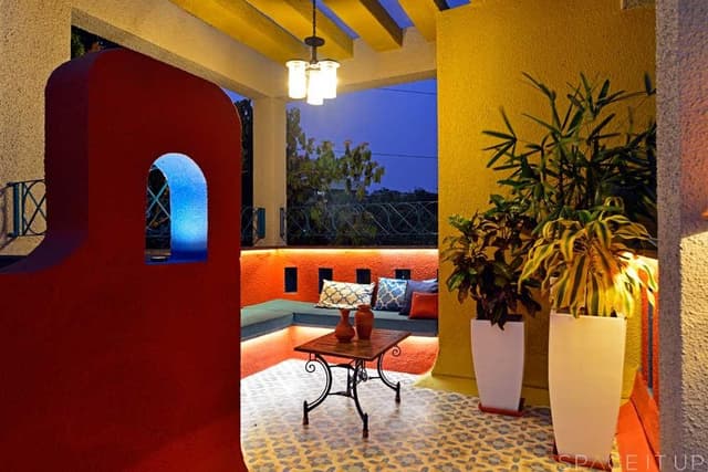 Home-Garden-on-Terrace-Floor-having-Parapet-Wall-with-Red-Wall-Paint-having-Voids-with-Blue-Wall-Paint-3 Swiper Content 2