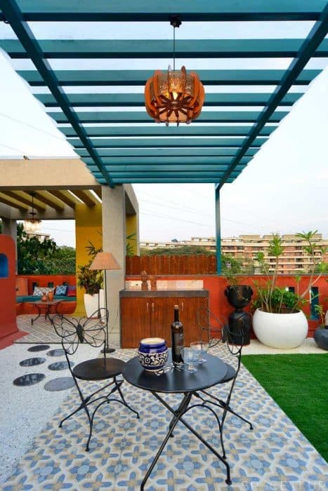 Home-Garden-on-Terrace-Floor-having-Parapet-Wall-with-Red-Wall-Paint-having-Voids-with-Blue-Wall-Paint-9 Swiper Content 7