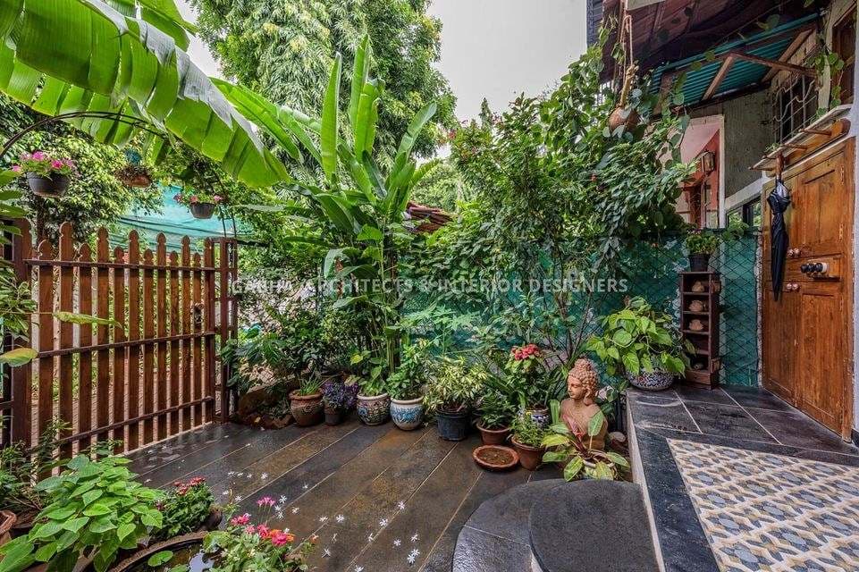 The-Exotic-Style-Entrance-of-this-Traditional-House-is-Very-Warm-Peaceful.-Stone-Flooring-with-Horizontal-Grooves-Flooring-of-the-Verandah-is-giving-a-Rustic-Touch-to-the-Space. The Exotic Style Entrance