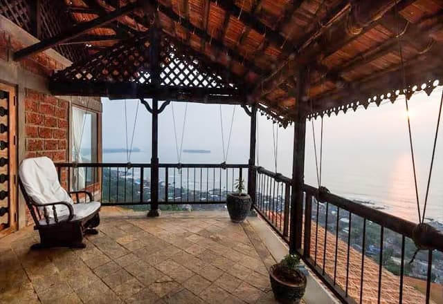 This-Vernacular-Style-Beach-Side-Balcony-having-Laterite-Stone-Wall-Rustic-Stone-Flooring-1 This Vernacular Style Beach Side Balcony