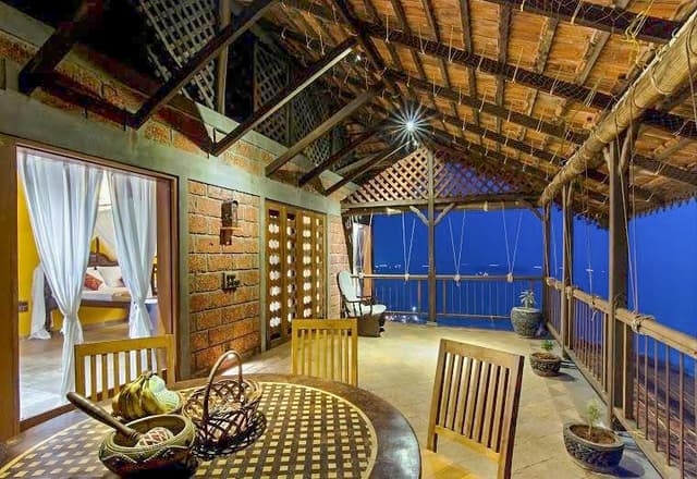 This-Vernacular-Style-Beach-Side-Balcony-having-Laterite-Stone-Wall-Rustic-Stone-Flooring.-1 This Vernacular Style Beach Side Balcony