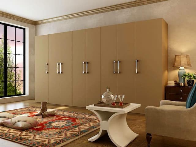 Beige full lintel height cupboards with single swing doors Beige full lintel height cupboards with single swing doors