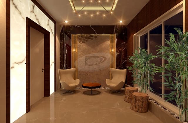 An Elegantly designed Verandah with a Marble Finish on Floor & Wall has 2 White Wingback Chairs & Coffee Table An Elegantly designed Verandah with a Marble Finish on Floor & Wall has 2 White Wingback Chairs & Coffee Table