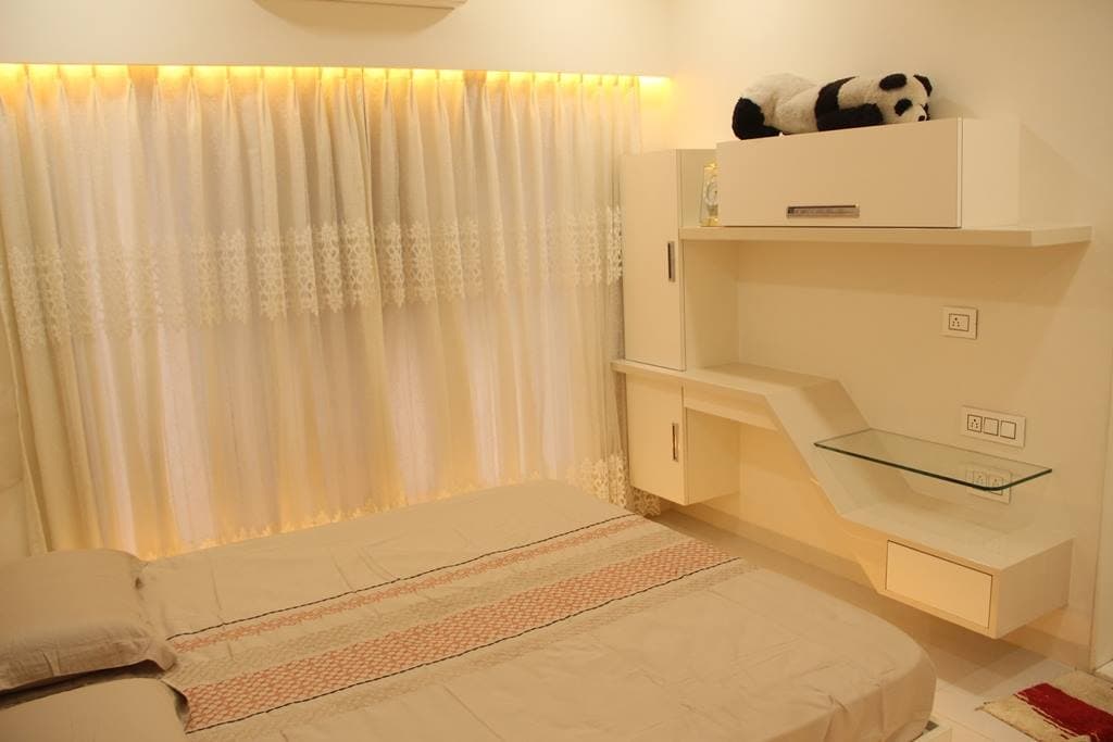 The White Bedroom Consists White Rectangular Bed with Cotton Bedsheet The White Bedroom Consists White Rectangular Bed with Cotton Bedsheet