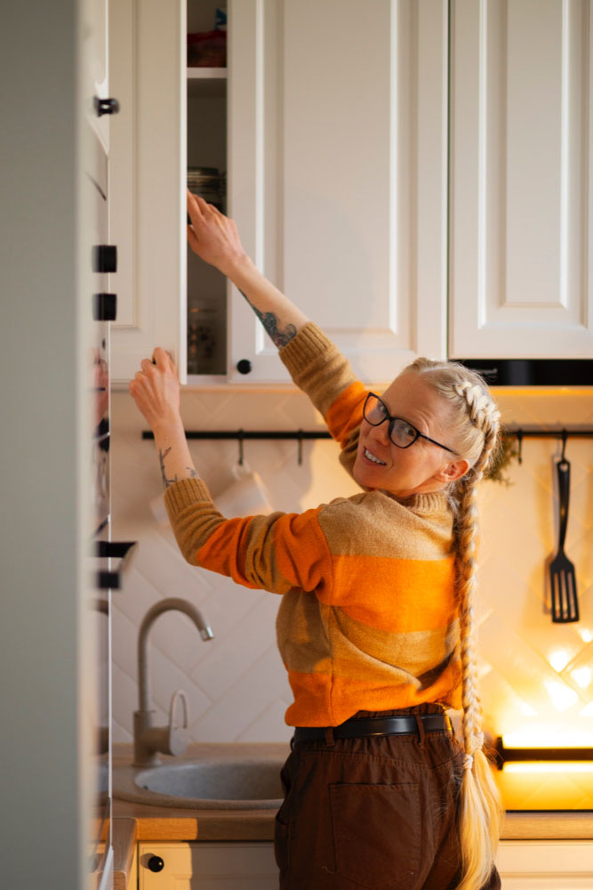 Tall Family Member Approaching Kitchen Cabinets