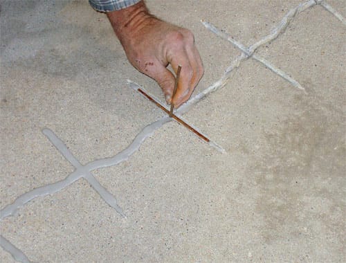 Repair of cracks in concrete
