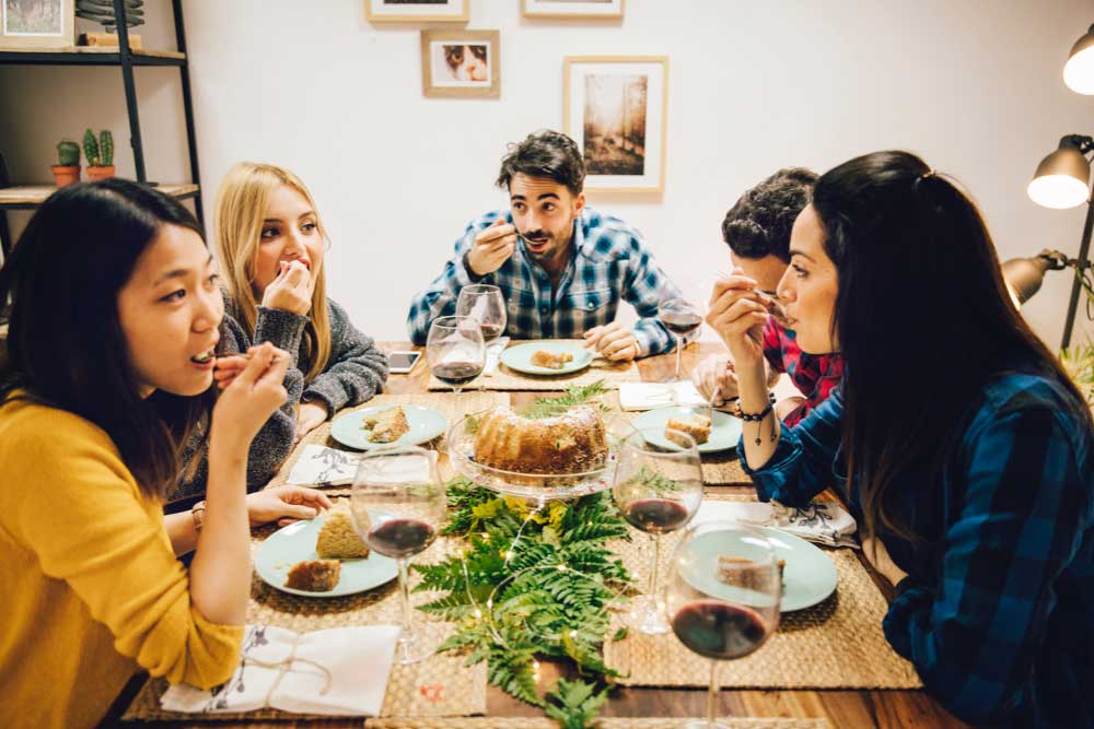 Family Seating Together at Dining Table