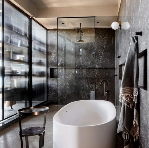 Black Bathroom with White Bathtub