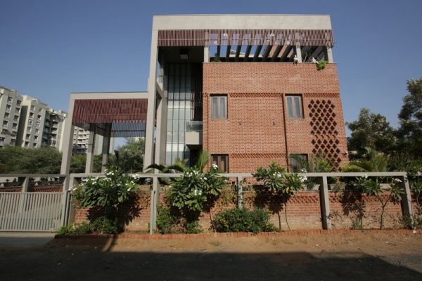 Exterior View of Contemporary Bungalow with Brick Cladding & Concrete