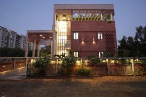 Exterior View of Contemporary Bungalow with Brick Cladding & Concrete