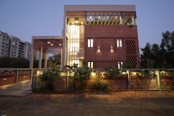 Exterior View of Contemporary Bungalow with Brick Cladding & Concrete