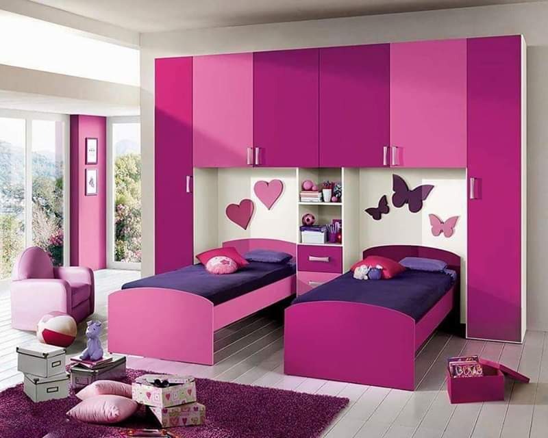 Pink Theme Kids Girls Bedroom with a Twin Beds Storages all Around Rug an Armchair