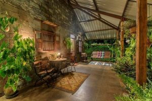 Traditional Rustic Style Residence has a Beautiful Verandah
