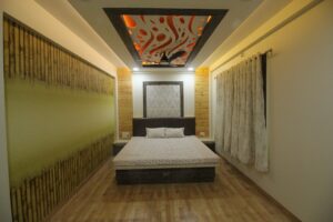 Bedroom incorporating Wooden Bed, Side Tables, Bamboo Wallpaper on one Wall