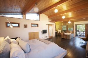 Rustic Bedroom accommodating Bed, T.V., Accent Chair with Footrest