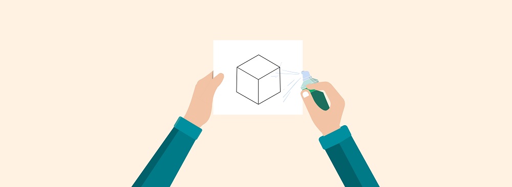Applying spray adhesive to cube photocopy