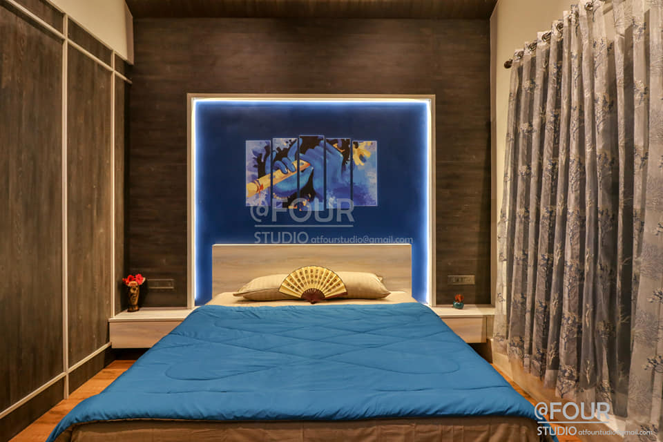 A modern designed bedroom in shades of blues and browns