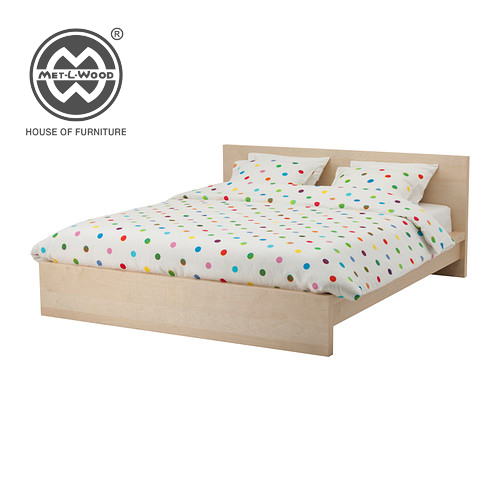 A bed made from light coloured wood