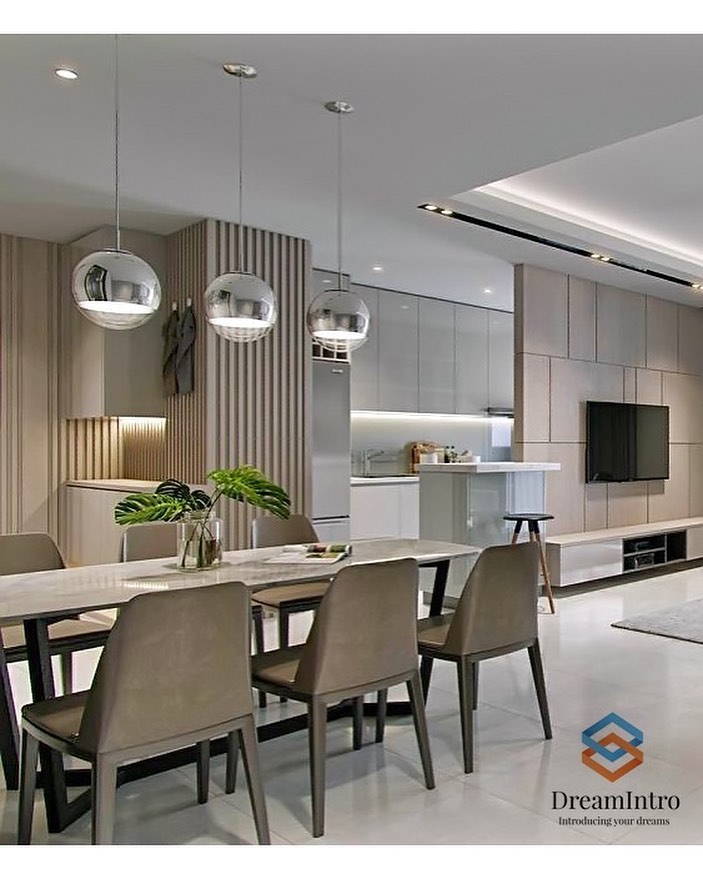 A grey shiny dining area with a table overlooking a living area