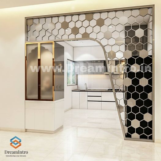 A white modern kitchen with a honeycomb partition