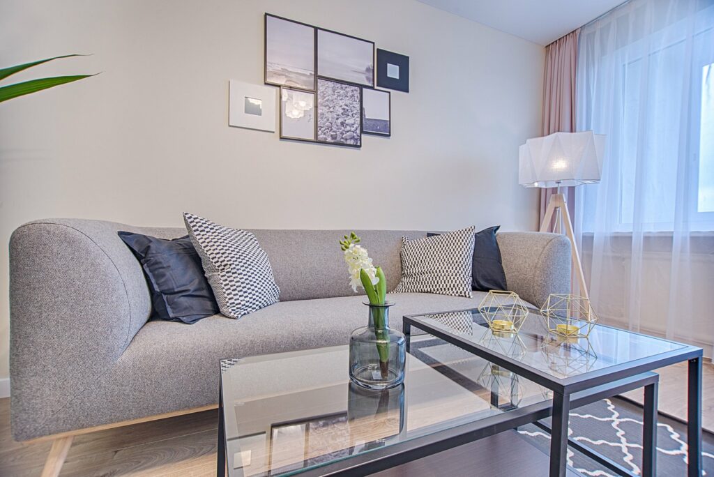 A greyish upholstered sofa