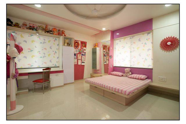 A kid's bedroom in white and pink
