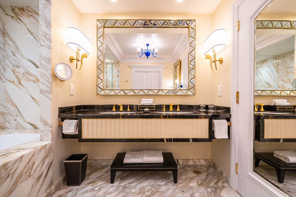 Classic Bathroom Lighting Traditional bathroom with warm, stylish lighting