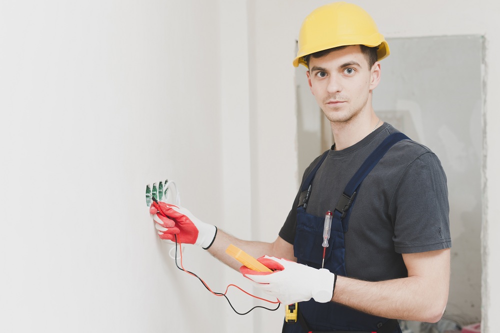 Professional Electrical Work Electrician working on bathroom wiring