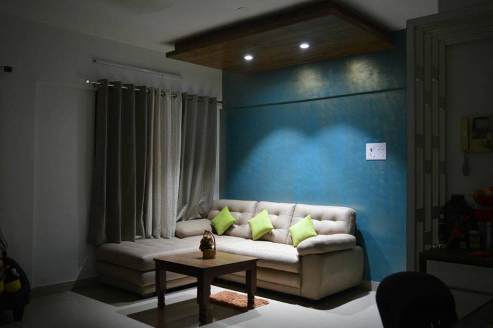 The grey room has a royal blue accent wall