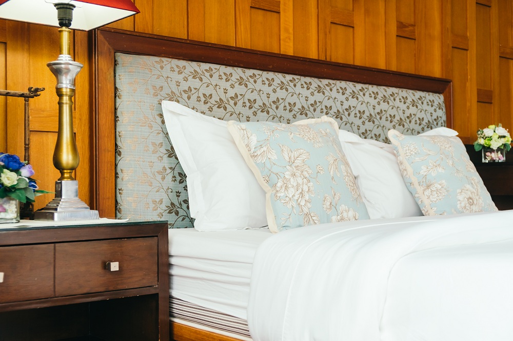 Reupholstered headboard for new traditional bedroom