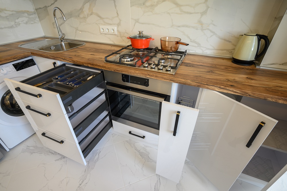 Fold-away counters for corridor kitchen