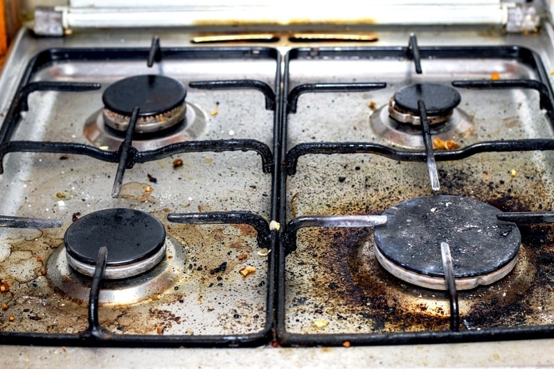An Old, Rusted Gas Stove An Old, Rusted Gas Stove